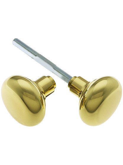 Pair of Round Brass Door Knobs in Unlacquered Brass.